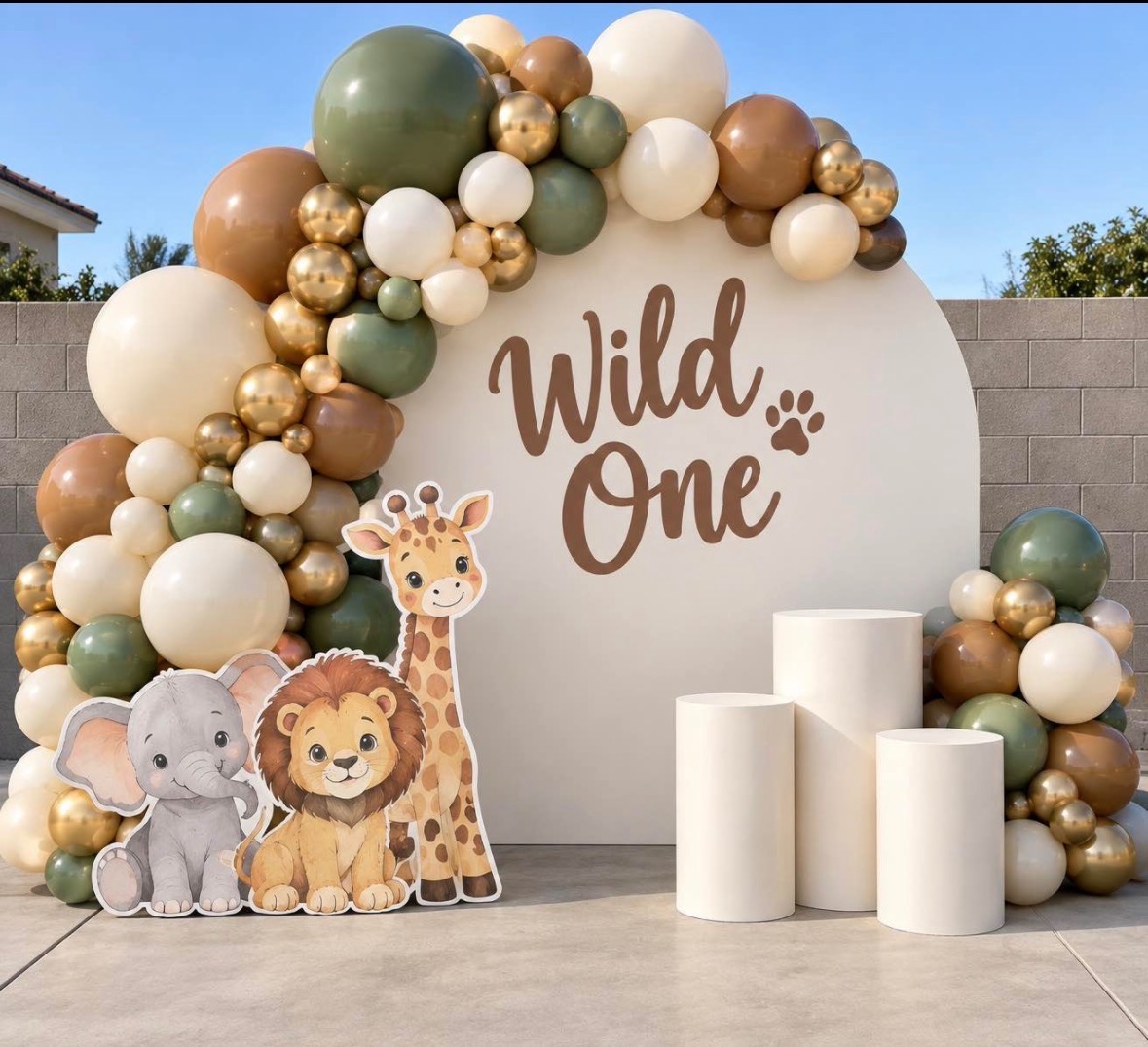 Wild One safari backdrop with a full organic balloon garland